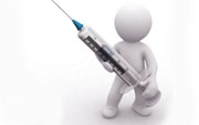 Person holding a syringe Person holding a syringe